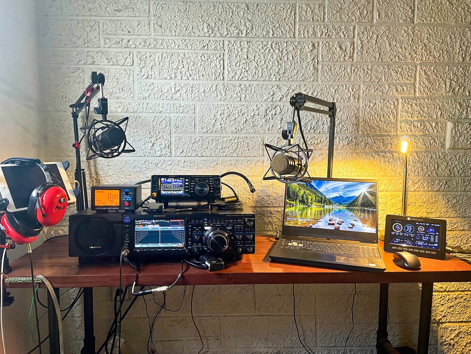 K4YZI amateur radio station with Yaesu transceivers, microphones and computer equipment